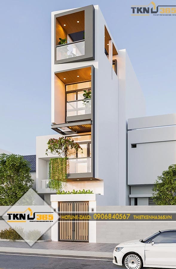 Nhà phố 4 tầng nổi bật với mặt tiền hiện đại kết hợp ban công kính và mảng xanh tạo cảm giác thông thoáng
