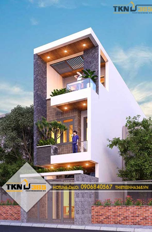 Mặt tiền nhà phố 3 tầng nổi bật với ban công rộng, trần ốp gỗ và hệ cây xanh giúp công trình luôn thông thoáng, nhiều ánh sáng