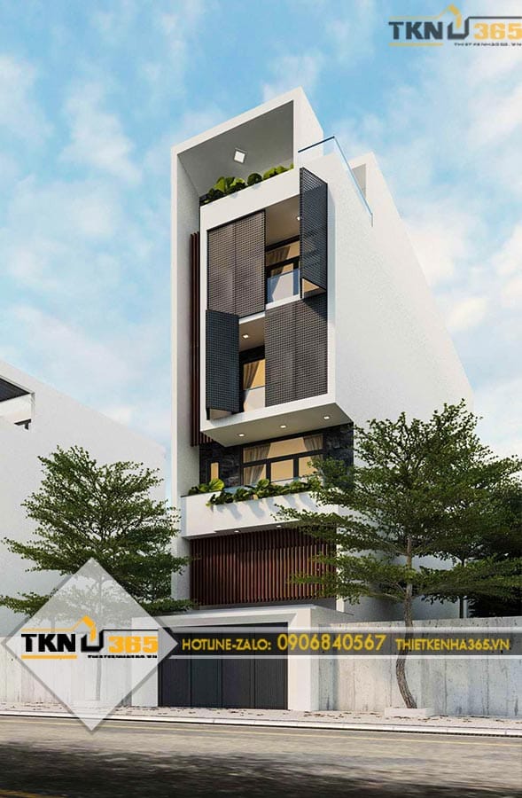 Nhà phố 6 tầng nổi bật với gam màu trắng chủ đạo, cửa kính lớn và các khoảng lùi hợp lý giúp công trình luôn thông thoáng