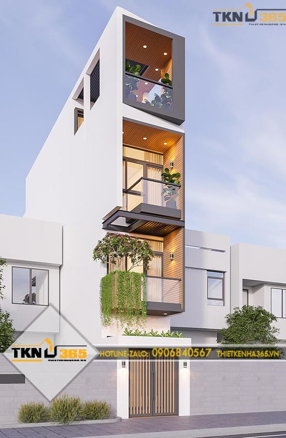 Nhà phố 4 tầng được thiết kế với ban công xanh xen kẽ các tầng, tăng khả năng lấy sáng và tạo điểm nhấn cho mặt tiền