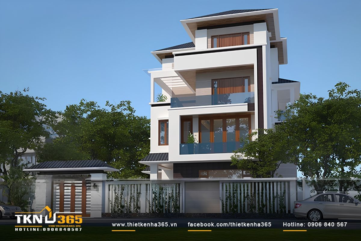 Chi tiết cổng chính sở hữu hệ mái dốc thu nhỏ bề thế kết hợp cánh cổng gỗ bản lớn, tạo nên diện mạo kiên cố và tăng tính thẩm mỹ đồng điệu cho mặt tiền biệt thự 4 tầng.
