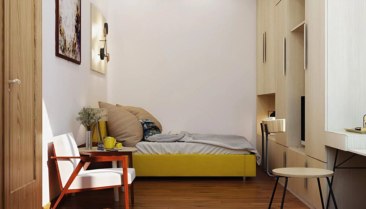 Kệ tủ được kê sát vách giường tạo sự tiện lợi trong chung cư 18m2