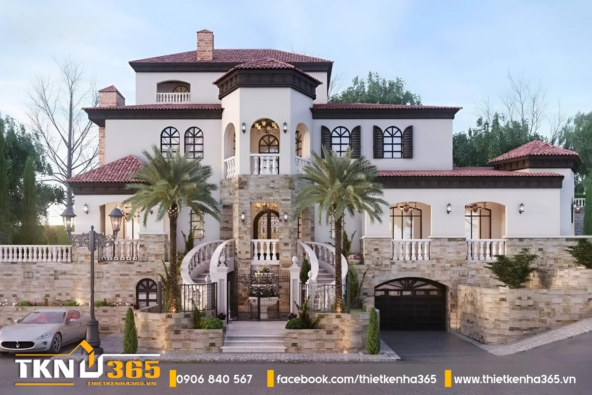 Biệt thự Địa Trung Hải nghỉ dưỡng 3 tầng ốp đá vững chãi, lối cầu thang rẽ 2 nhánh cổ điển.