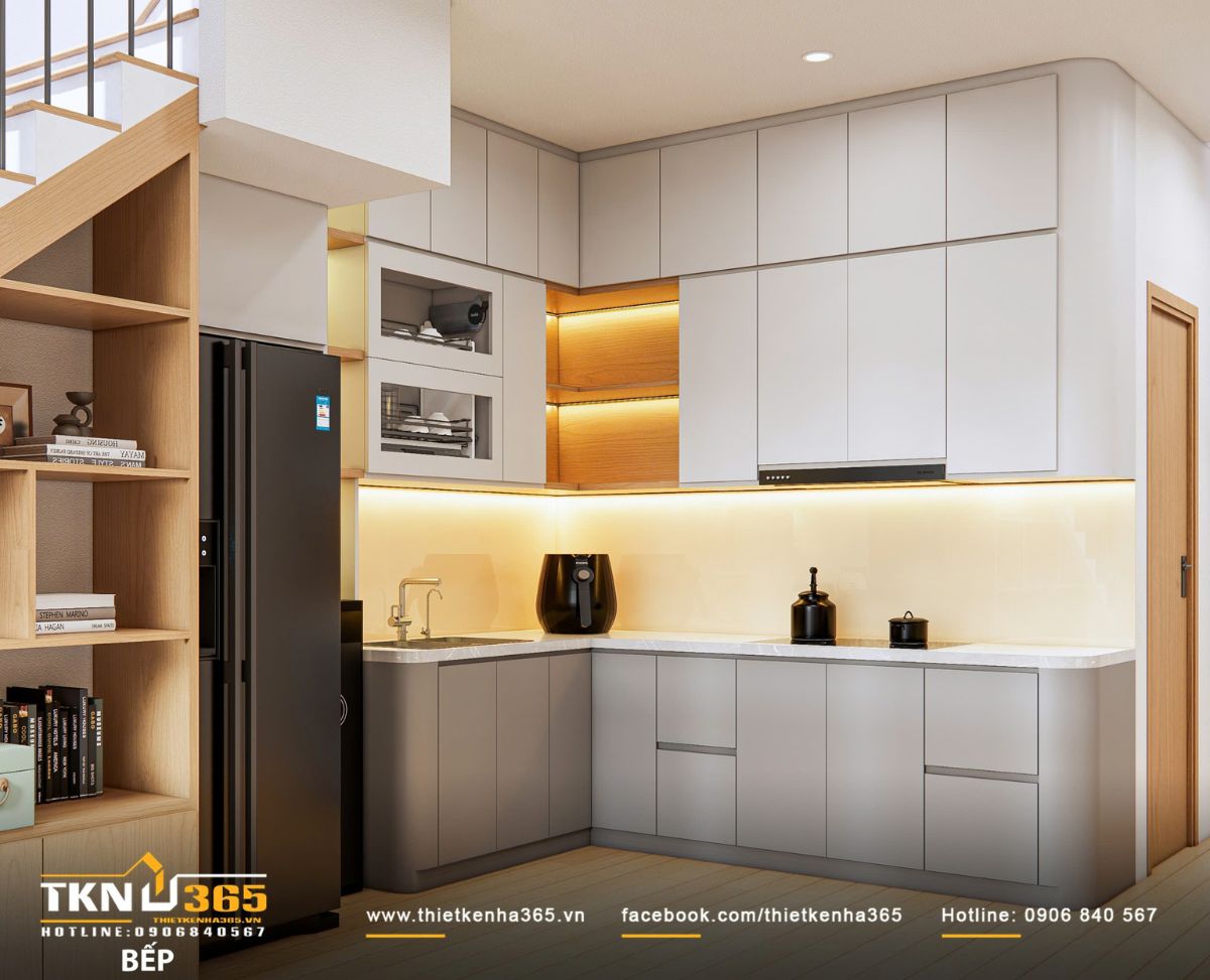 Thiết kế nội thất nhà phố 2 tầng ở Bình Dương: Gọn gàng và đủ đầy 9 Bếp và tủ lưu trữ được bố trí liền mạch, giữ cho không gian luôn sáng và sạch