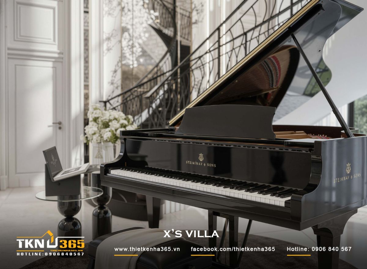 Khu vực thông tầng đặt đàn piano kết hợp cầu thang cong, tạo điểm chạm cảm xúc nhẹ nhàng trong tổng thể nội thất tân cổ điển