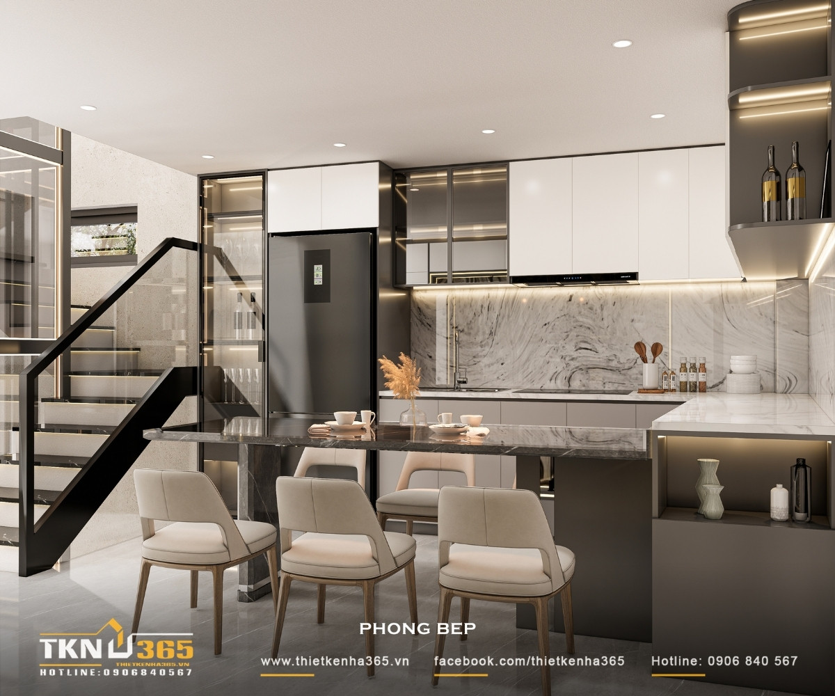 Nhà phố 5 tầng hiện đại ở quận 12 và cách giải quyết bài toán diện tích trên lô đất hẹp ngang 22 Đảo bếp tích hợp bàn ăn sử dụng mặt đá tông sẫm, đóng vai trò điểm nhấn trung tâm