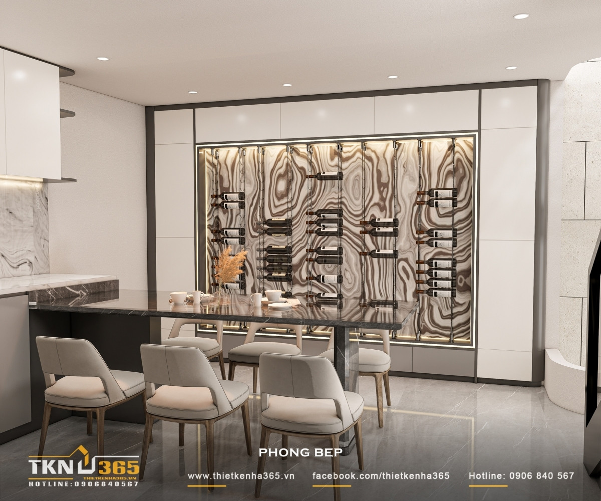 Nhà phố 5 tầng hiện đại ở quận 12 và cách giải quyết bài toán diện tích trên lô đất hẹp ngang 23 Mảng tường bếp ốp đá vân mây liên tục từ mặt bếp lên backsplash, tạo chiều sâu thị giác và cảm giác liền mạch