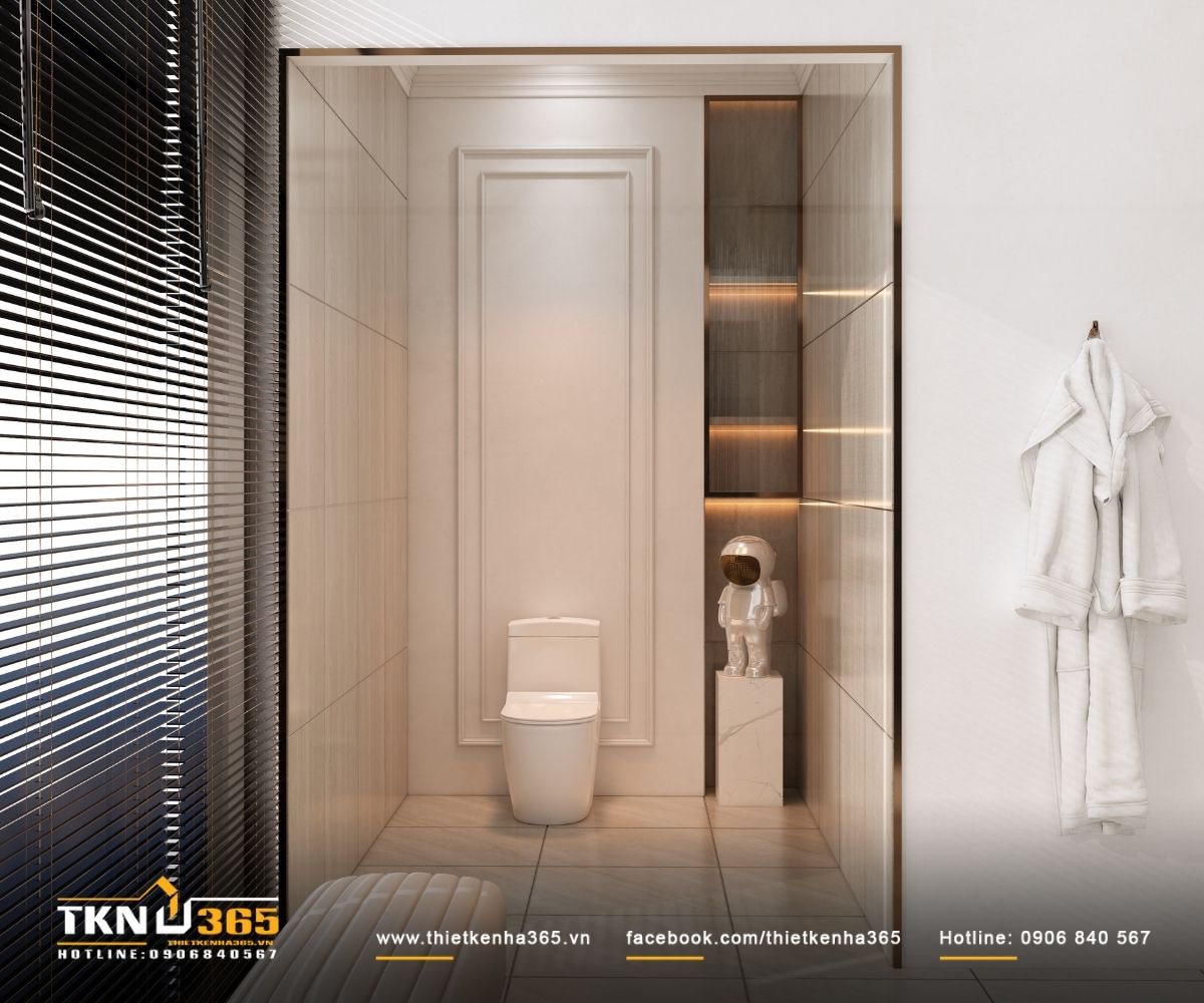 Khu vệ sinh tách biệt, tổ chức gọn gàng với ánh sáng hắt khe và bảng màu trung tính, giữ sự sạch sẽ và yên tĩnh cho toàn bộ không gian