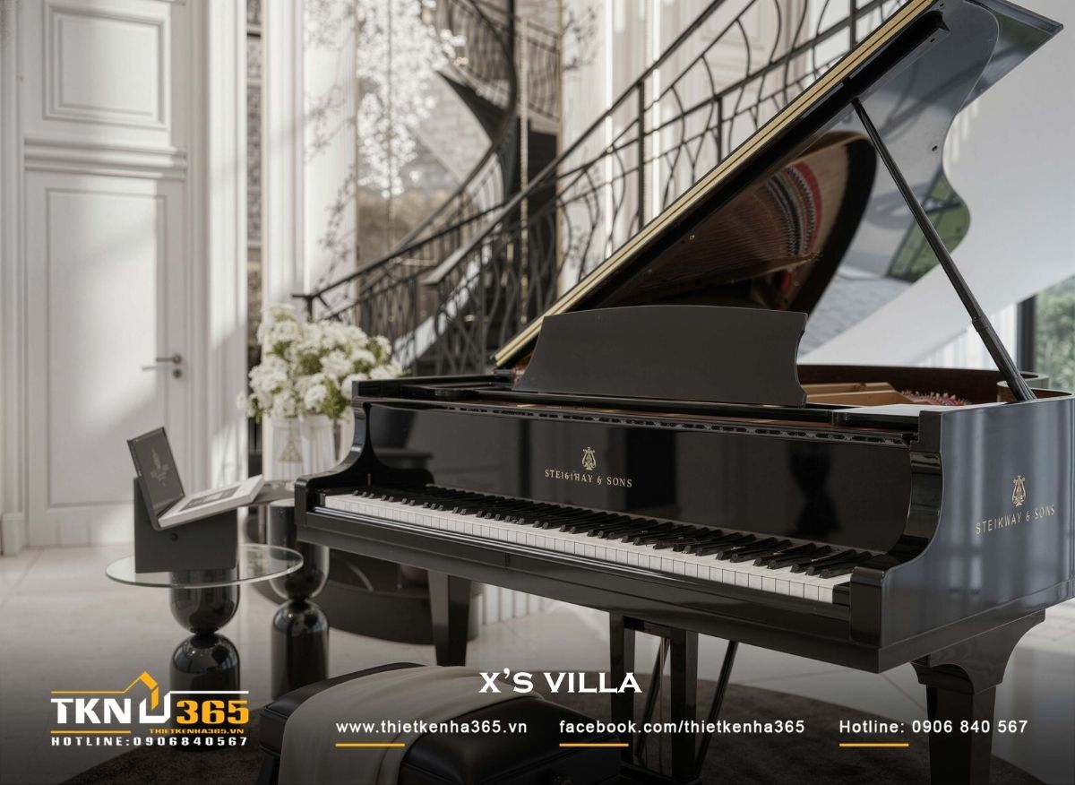 Đàn piano đen bóng đặt dưới không gian thông tầng, nơi ánh sáng, âm nhạc và kiến trúc giao thoa, tạo điểm nhấn cảm xúc cho phòng khách