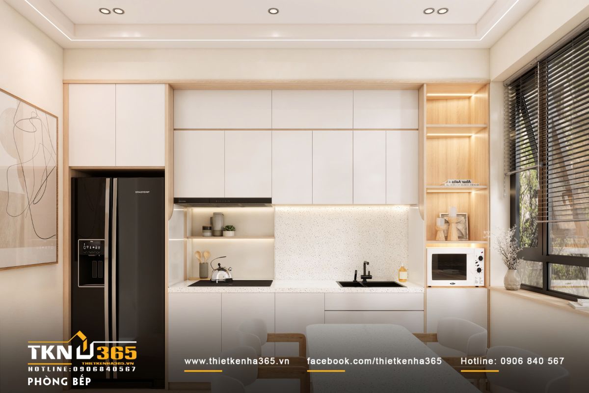 Thiết kế bếp tối giản với thiết bị âm tủ, ánh sáng gián tiếp và chi tiết gỗ sáng, cân bằng giữa tiện nghi và sự thoải mái