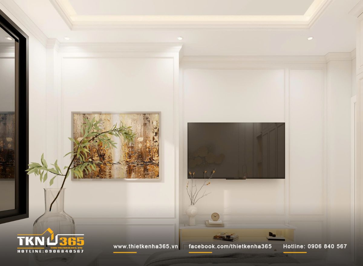 Nền tường sáng trung tính kết hợp tranh treo tiết chế giúp không gian giữ chiều sâu cảm xúc mà vẫn dễ chịu