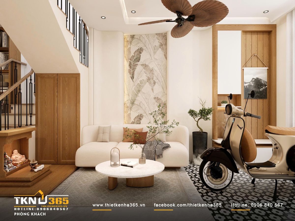 Phòng khách tổ chức gọn gàng với sofa sáng màu, chất liệu gỗ ấm và bố cục mở, tạo cảm giác thư thái ngay từ lối vào