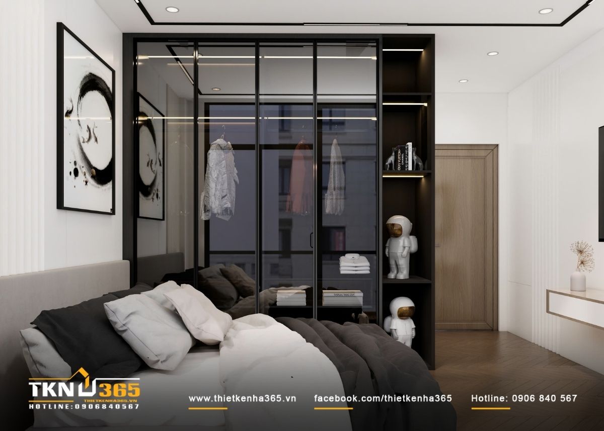 Thiết kế nội thất nhà phố 4 tầng kết hợp không gian ở và kinh doanh 11 Hệ tủ quần áo cánh kính khung đen tạo chiều sâu không gian, đồng thời giúp việc lưu trữ trở nên trực quan, ngăn nắp