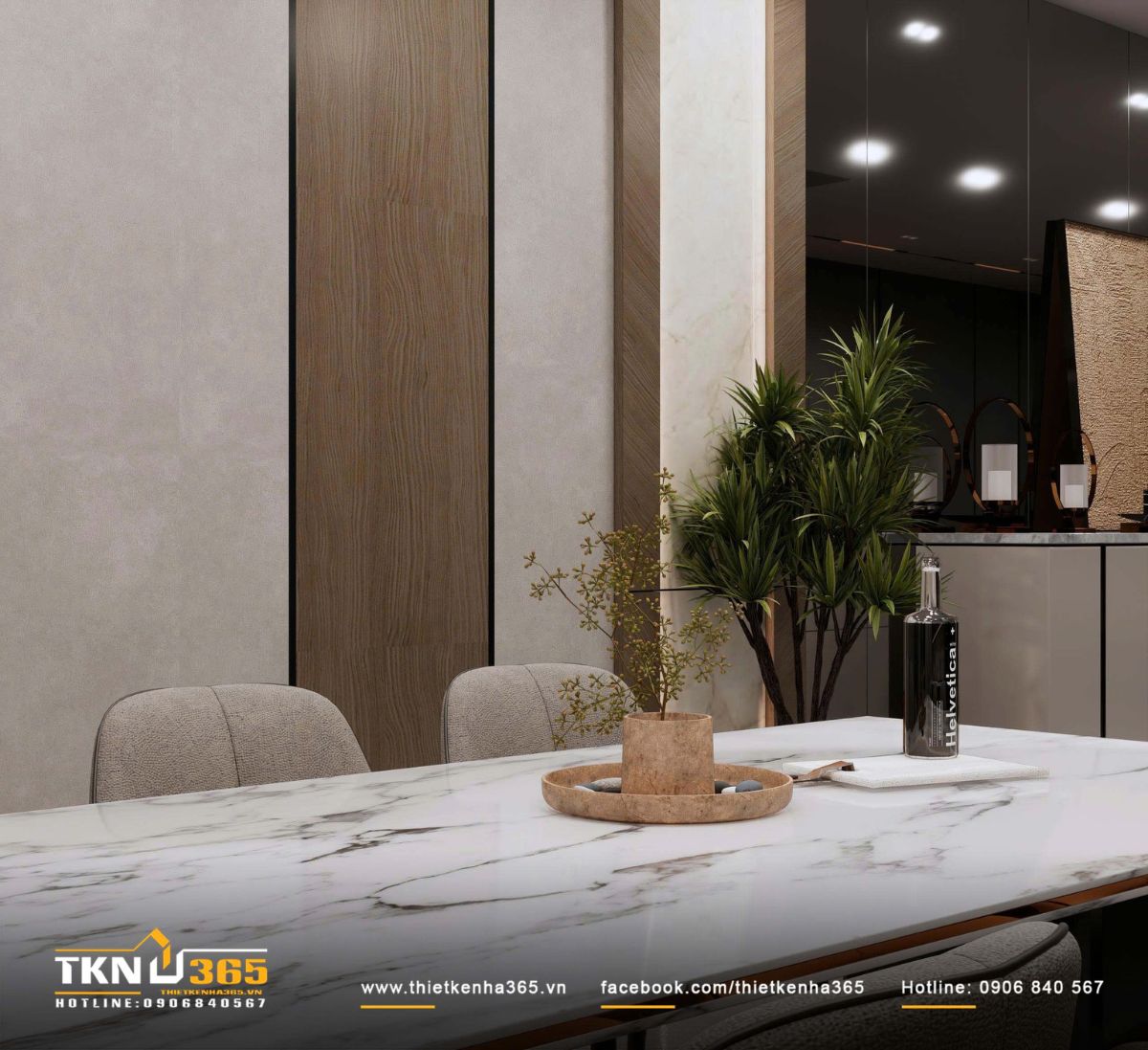 Mặt bàn ăn với khay đá trang trí và cành xanh nhỏ, bổ sung yếu tố mềm mại giữa các bề mặt đá và kim loại