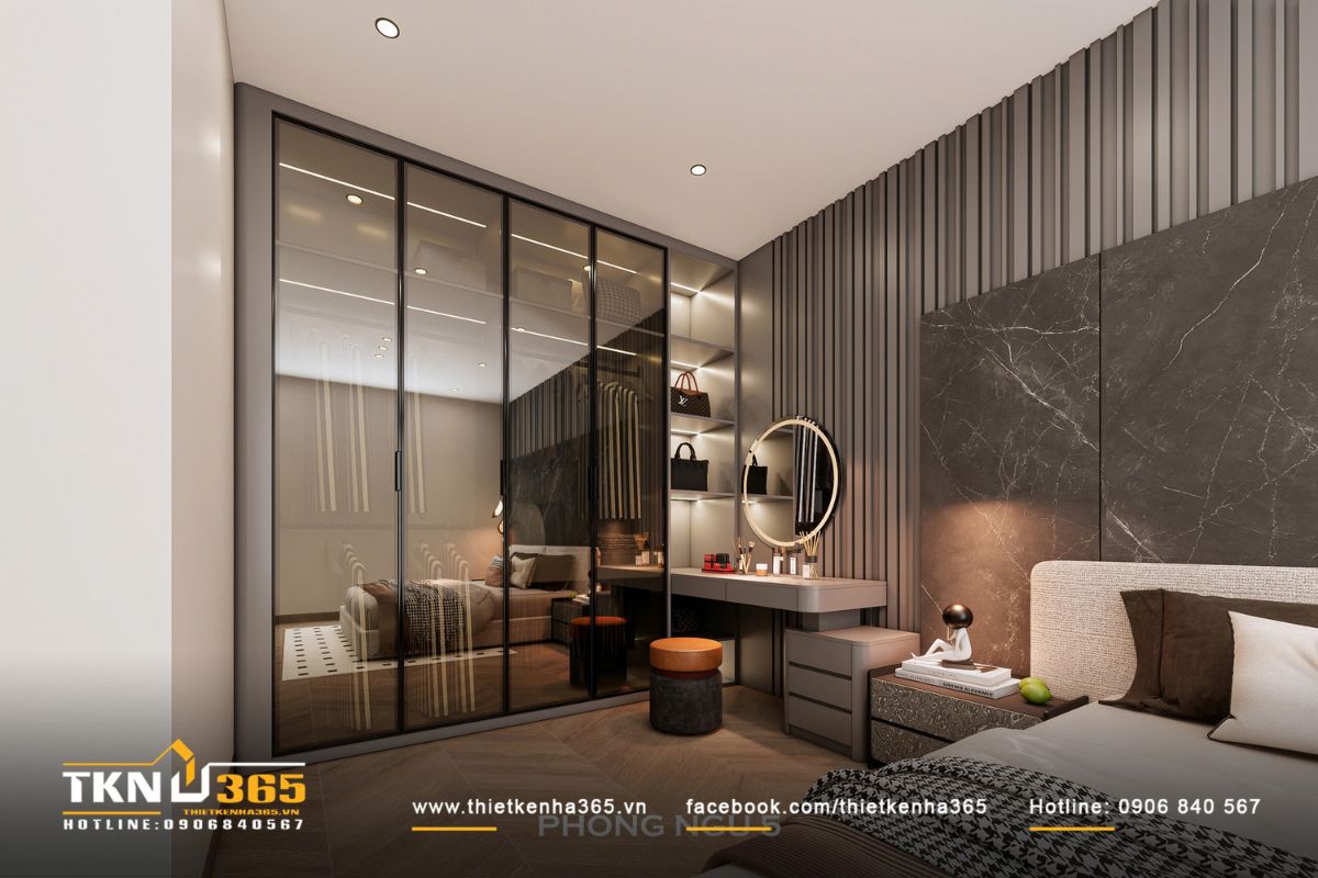 Hệ tủ quần áo và bàn trang điểm cho thấy sự chỉn chu trong xử lý vật liệu và ánh sáng của thiết kế nội thất nhà phố 4 tầng