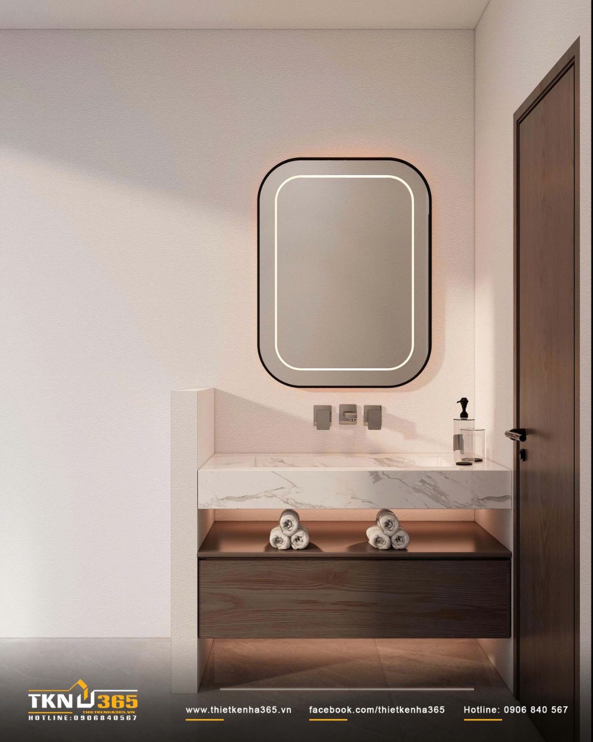 Lavabo treo kết hợp mặt đá trắng và hộc gỗ tối phía dưới, được nhấn bằng ánh sáng hắt nhẹ giúp khối tủ trông gọn và nhẹ hơn