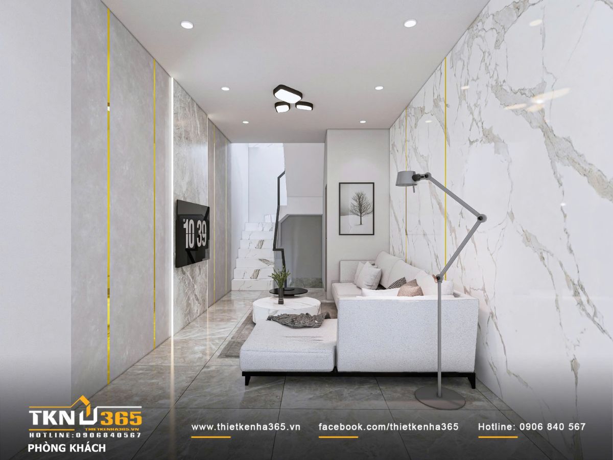 Thiết kế phòng khách nhấn mạnh sự liền mạch không gian, ánh sáng âm trần và đèn cây ánh vàng dịu giúp tổng thể nhẹ nhàng và ấm áp