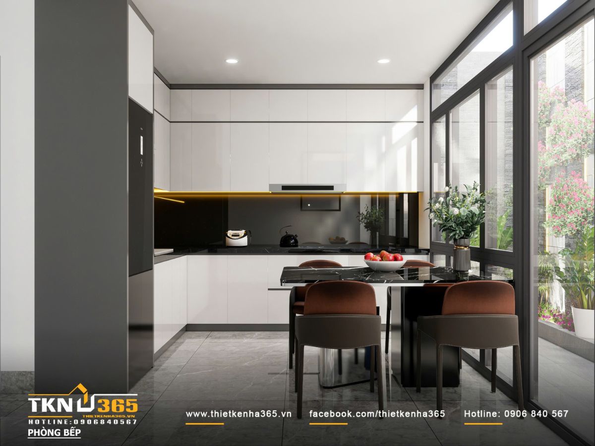 Thiết kế nội thất nhà phố mặt tiền 3m - Giải quyết bài toán ánh sáng và tổ chức không gian hẹp 4 Khu vực bếp thiết kế liền mạch với không gian sinh hoạt chung, sử dụng bảng màu trắng - đen tiết chế, tạo cảm giác gọn gàng và hiện đại