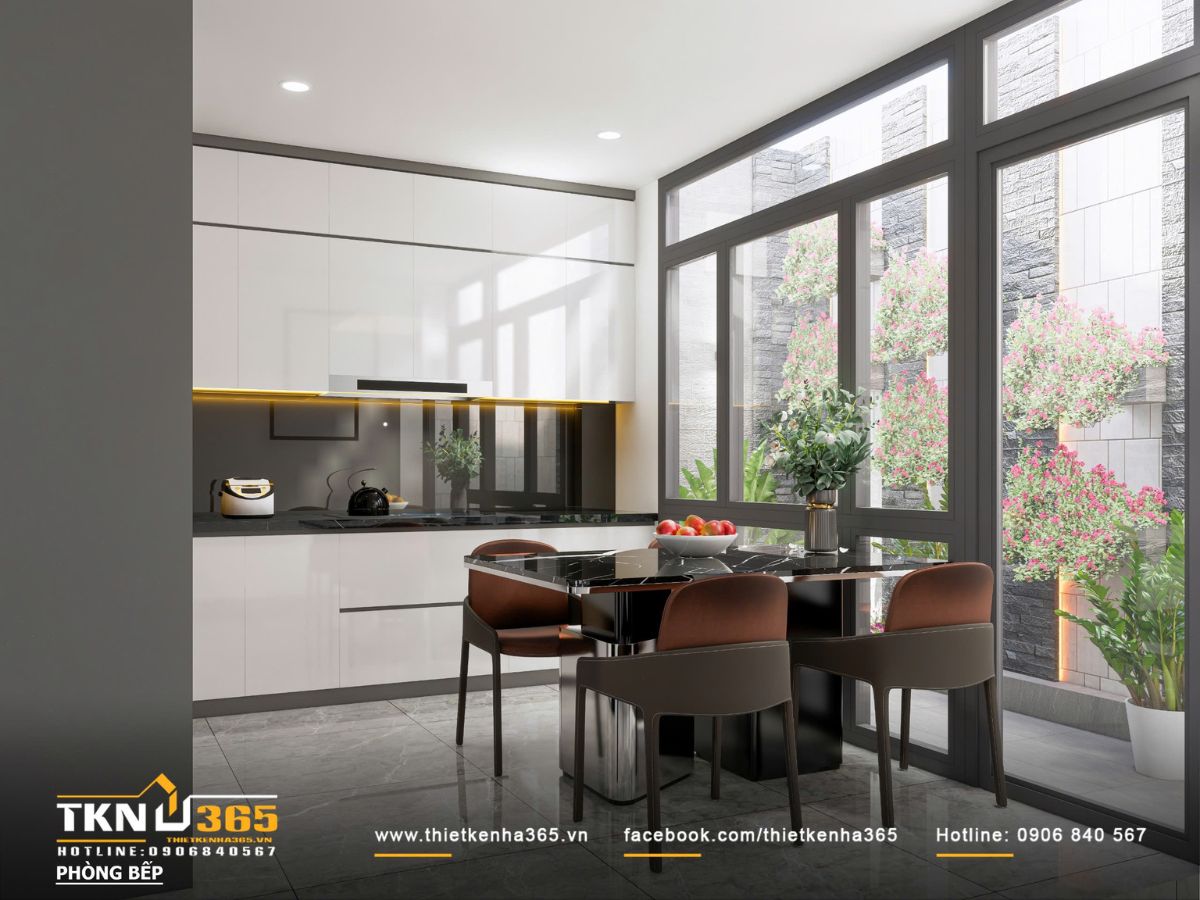 Thiết kế nội thất nhà phố mặt tiền 3m - Giải quyết bài toán ánh sáng và tổ chức không gian hẹp 6 Hệ tủ bếp phẳng tay nắm âm kết hợp mặt đá đen bóng, vừa đảm bảo thẩm mỹ tối giản vừa thuận tiện trong sử dụng và vệ sinh hàng ngày