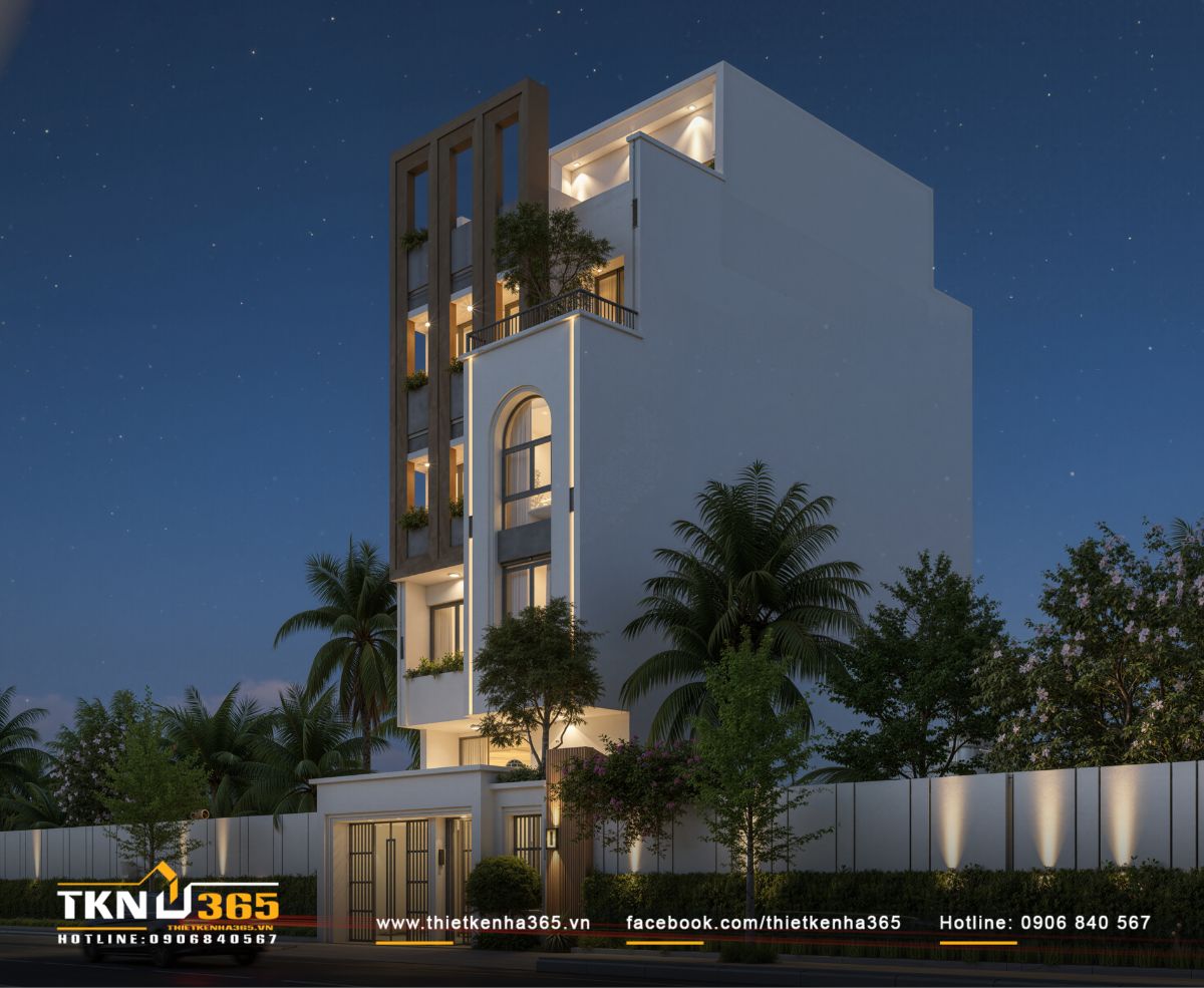 Nhà phố 6 tầng về đêm với hệ đèn hắt làm nổi bật cấu trúc hình khối và chiều cao công trình