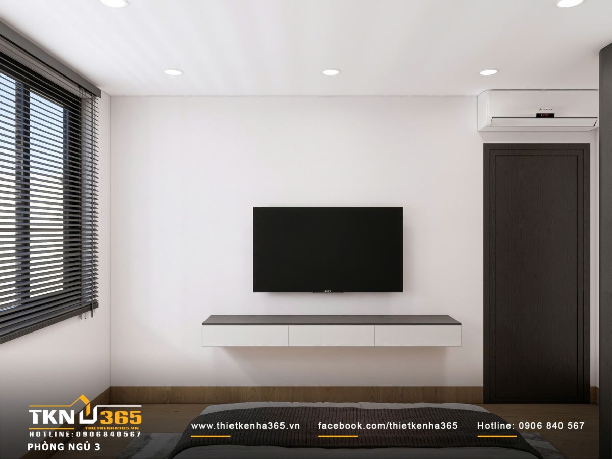 Kệ TV treo tường thiết kế tối giản, kết hợp mảng tường trắng giúp không gian gọn gàng và hiện đại