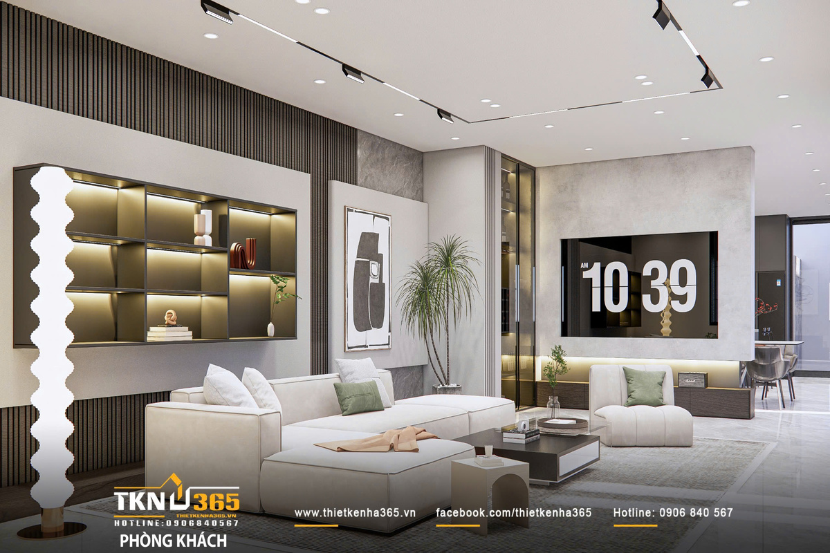 Thiết kế nội thất biệt thự phố 2 tầng H’S House : Không gian sống cân bằng giữa tiện nghi và vi khí hậu 15 Bộ sofa dáng thấp cùng thảm lớn định hình khu vực sinh hoạt, trong khi hệ tủ âm tường với ánh sáng hắt tạo chiều sâu thị giác