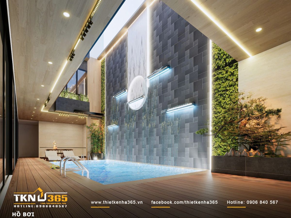 Thiết kế nội thất biệt thự phố 2 tầng H’S House : Không gian sống cân bằng giữa tiện nghi và vi khí hậu 6 Tường nước với lớp đá tối màu và ánh sáng hắt tạo nên bề mặt chuyển động, góp phần giảm nhiệt và tăng độ ẩm cho không gian