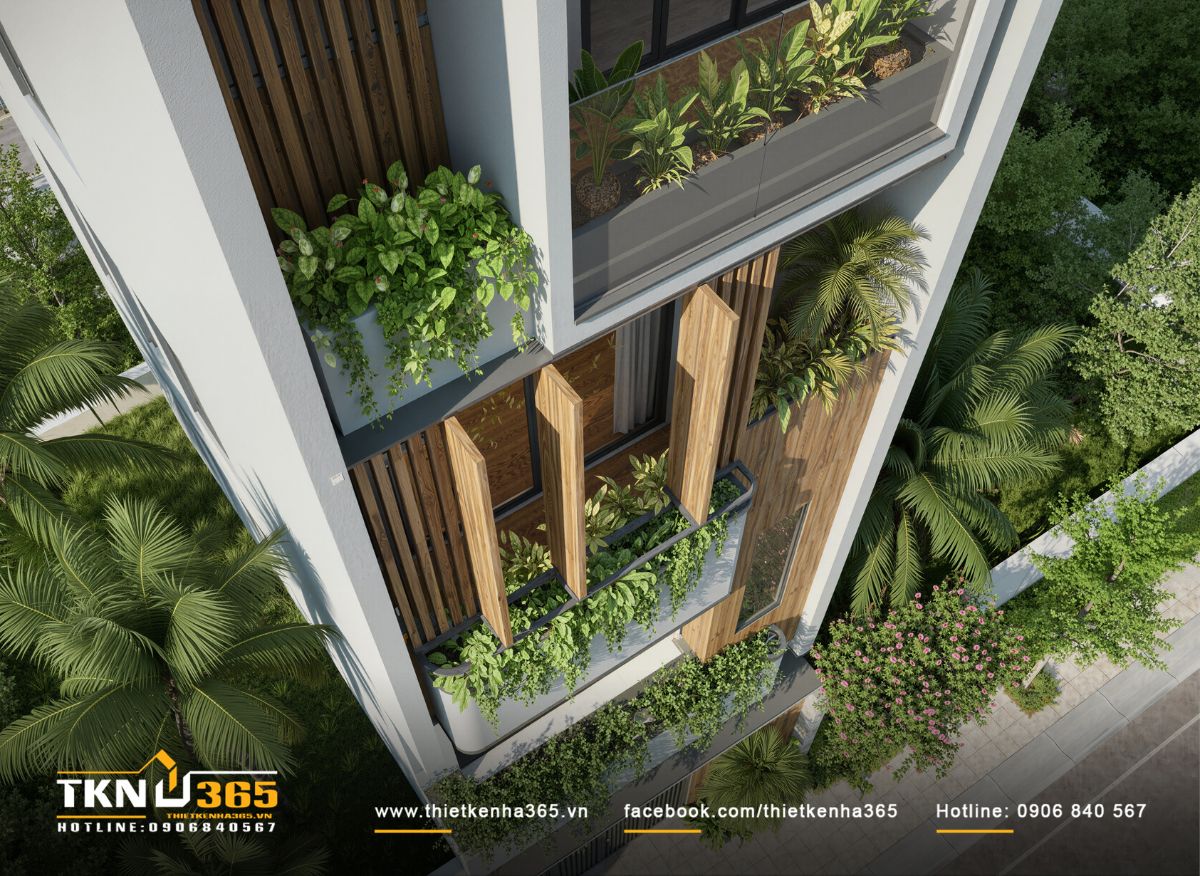 Nhà phố 4 tầng bố trí nhiều lớp cây xanh xen kẽ hệ lam đứng nhằm kiểm soát nắng và tăng sự riêng tư cho không gian bên trong