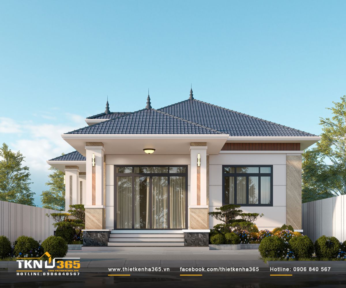 Nhà phố 1 tầng nổi bật với hệ mái dốc nhiều lớp, hiên rộng và những mảng vật liệu sáng tối được phối hợp cân đối trên mặt tiền 9m