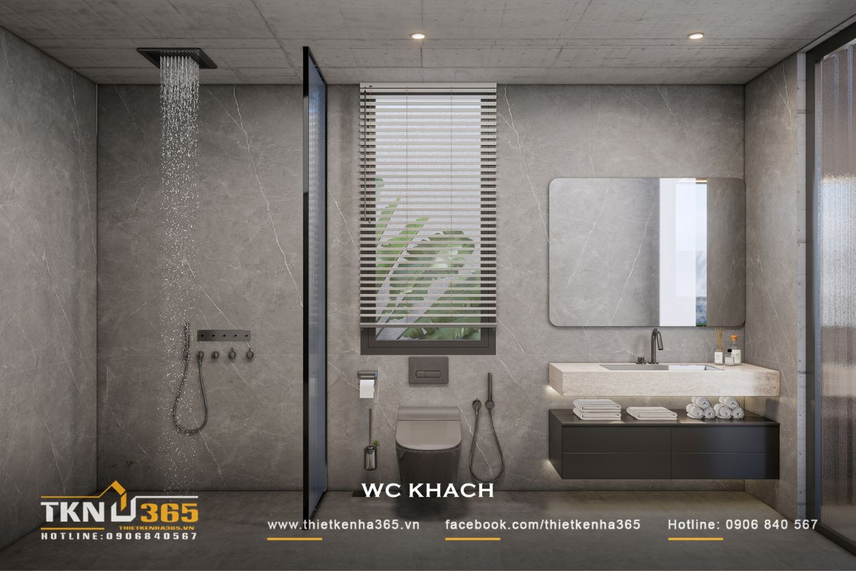 Nhà phố 1 tầng 8x15m biến khoảng sân rộng thành không gian nghỉ dưỡng mỗi ngày 45 WC khách tiếp tục sử dụng vật liệu xám cùng thiết bị tối màu, tạo sự thống nhất với WC master và ngôn ngữ nội thất chung của ngôi nhà