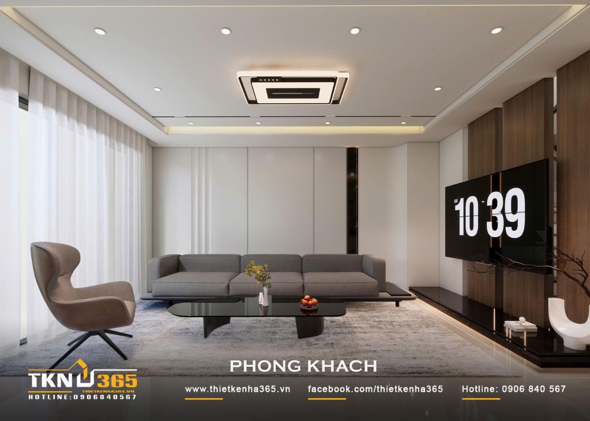 Nhà phố 2 tầng hiện đại của chị Hương tích hợp quán cà phê nhưng vẫn giữ sự riêng tư cho gia đình đông thành viên 13 Sofa xám, bàn trà đen và thảm lớn tạo độ tương phản nhẹ trên nền nội thất trung tính